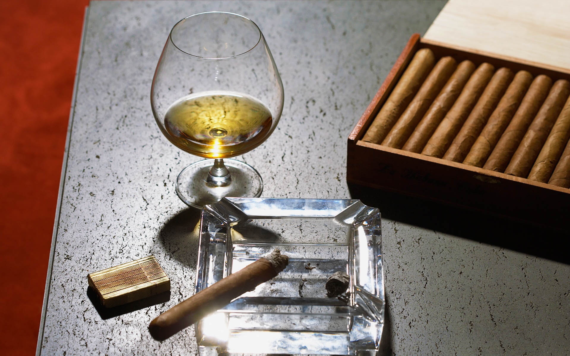 Close Up Of Cognac Glass And Cigars