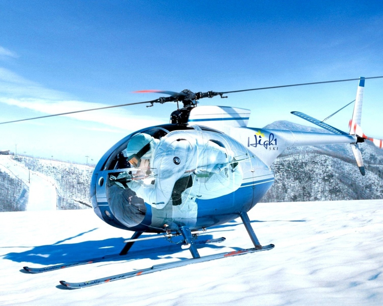 Mini Helicopters On The Snow Capped Mountain