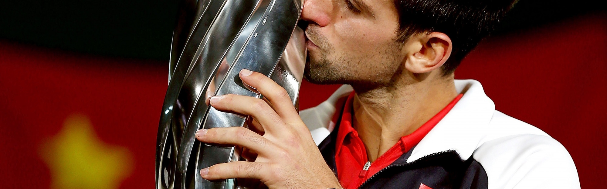 Novak Djokovic Kisses The Trophy