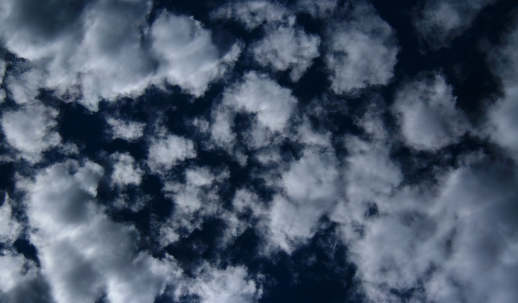 Puffy Clouds On Dark Blue Sky Texture