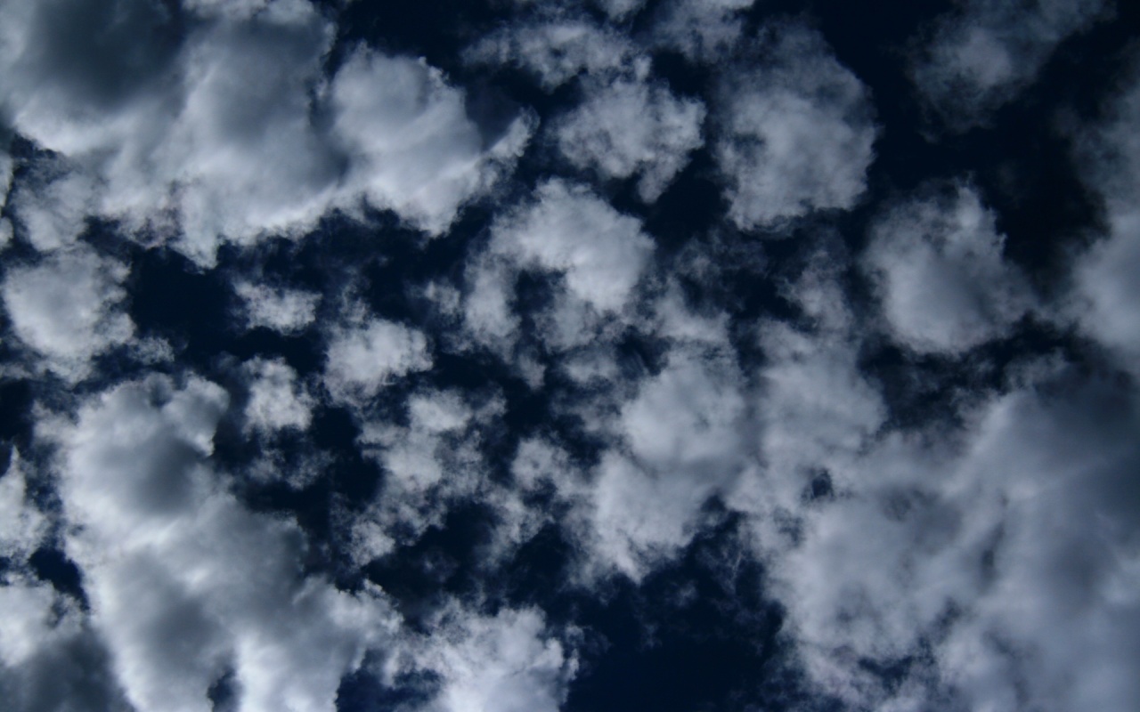 Puffy Clouds On Dark Blue Sky Texture