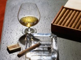 Close Up Of Cognac Glass And Cigars