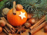 Orange With Cinnamon Sticks