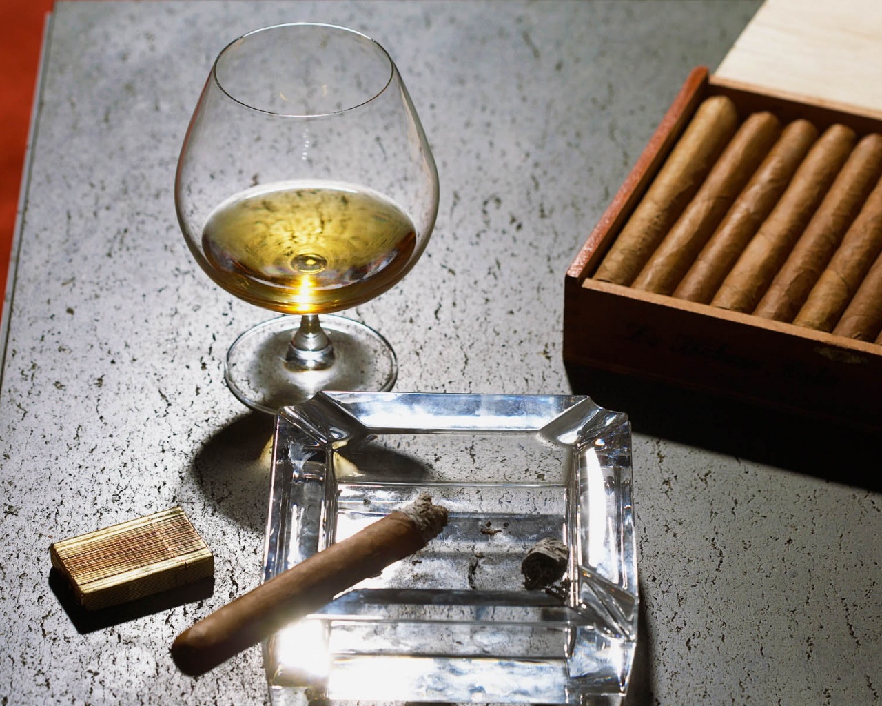 Close Up Of Cognac Glass And Cigars