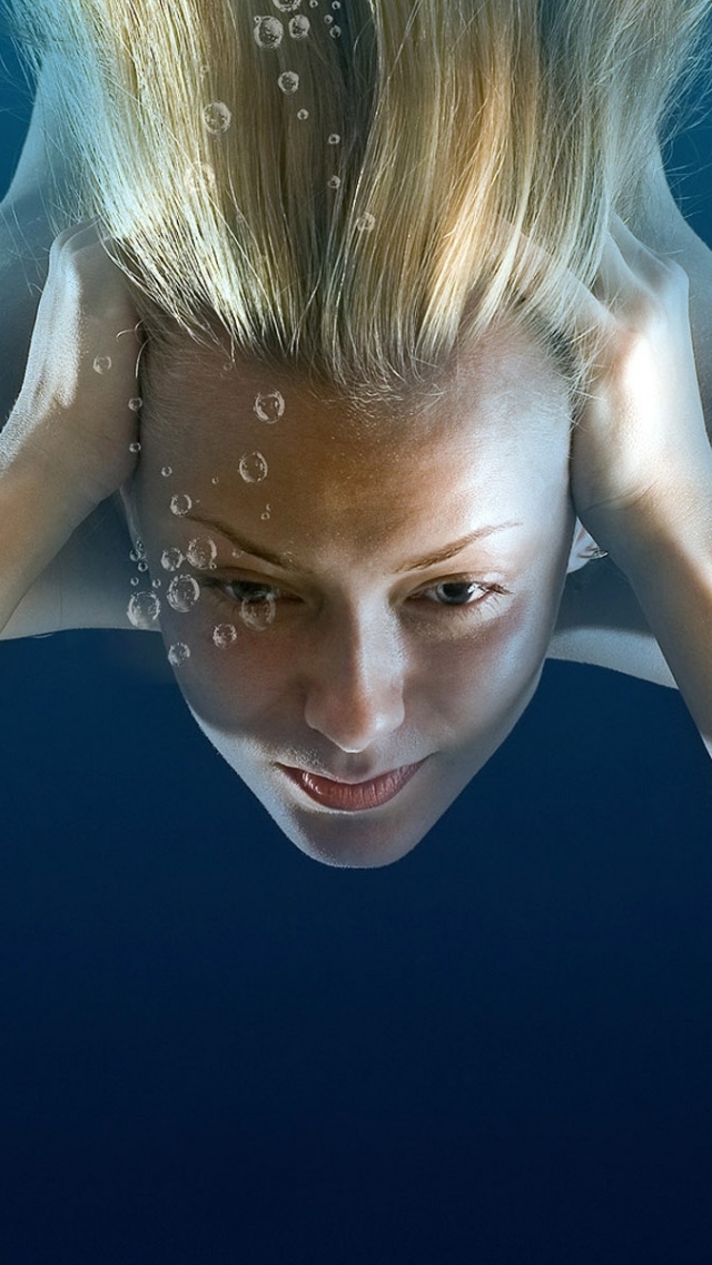 Girl Under Water Immersing Blonde Bubbles