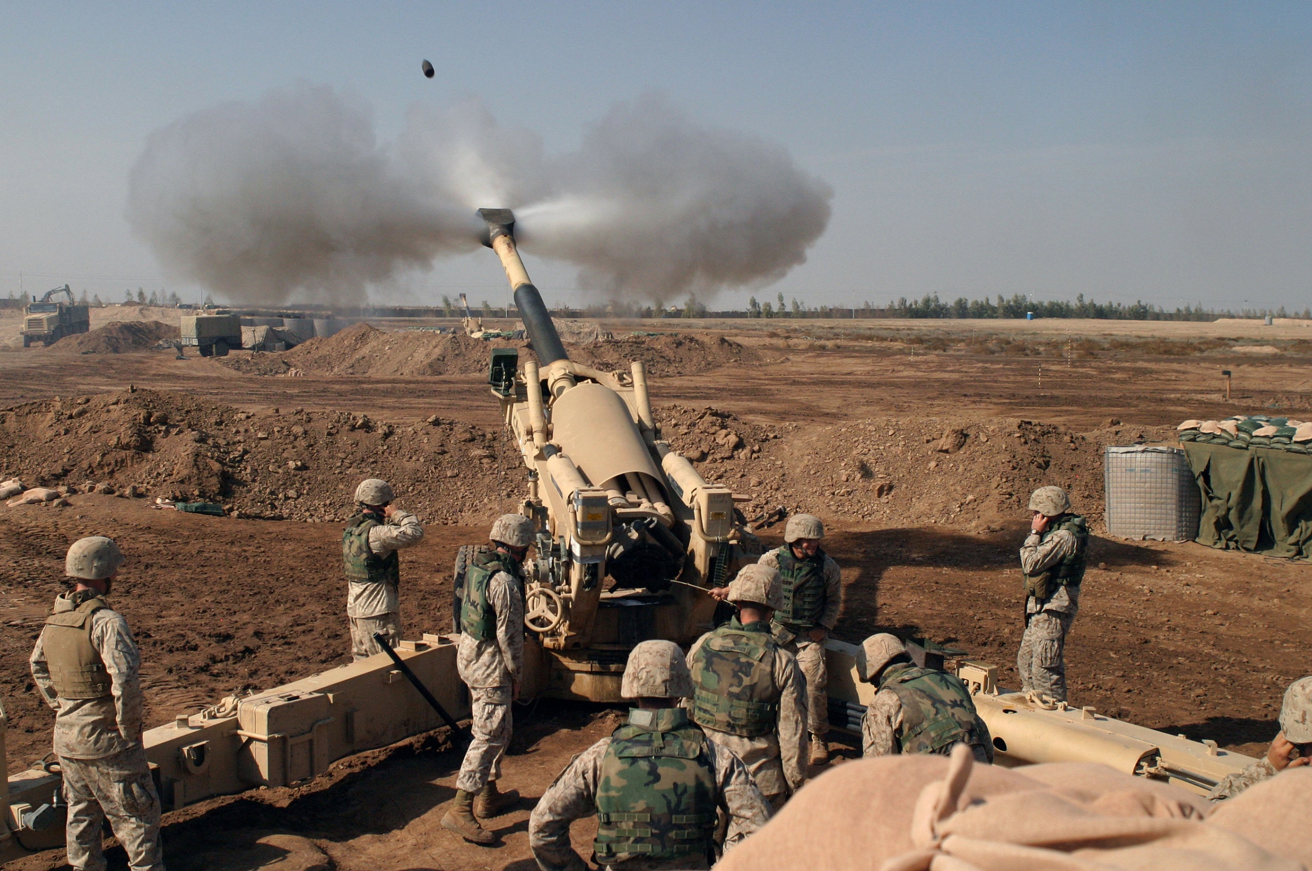 Soldiers Fire From Howitzers